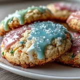 Bright, tender lemon-infused sugar cookies topped with a smooth pastel glaze for a cheerful dessert.
