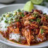 Vibrant salsa chicken bowls topped with avocado, cherry tomatoes, and melted cheese for a satisfying meal.  
